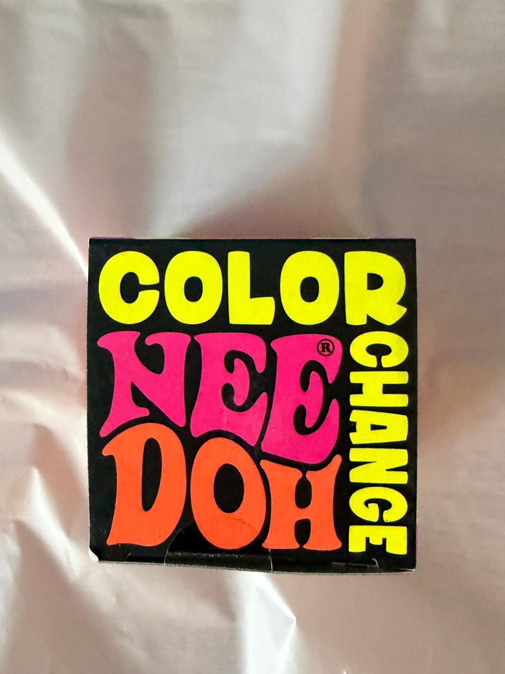 Color NeeDoh Color Change Kids Toy - Black with Bright Yellow & Orange